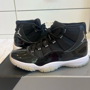 Air Jordan 11s- Black and White High-Top Sneakers